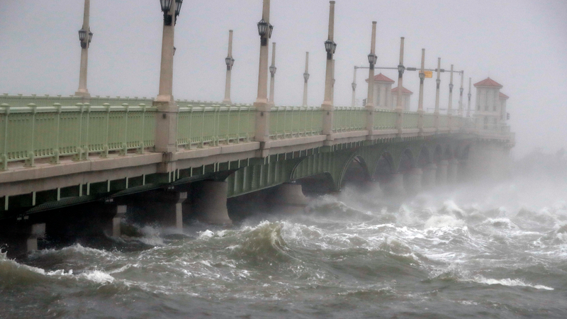Waves from Hurricane Matthew crash against a bridge Friday, Oct. 7, 2016, in St. Augustine, Fla. Matthew was downgraded to a Category 3 hurricane overnight, and its storm center hung just offshore as it moved up the Florida coastline, sparing communities its full 120 mph winds. (Image: AP)